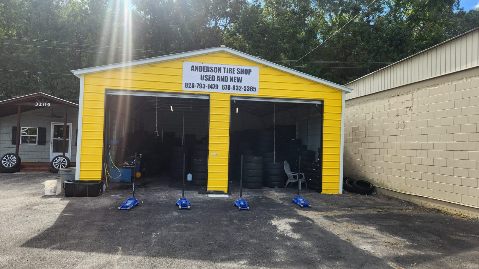 Our two-bay yellow shop with tire machines out front